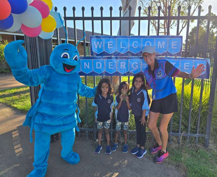 Photo of 3 students with an S L S O and Bluey (our Blue Yabbie Mascot) on the first day of school