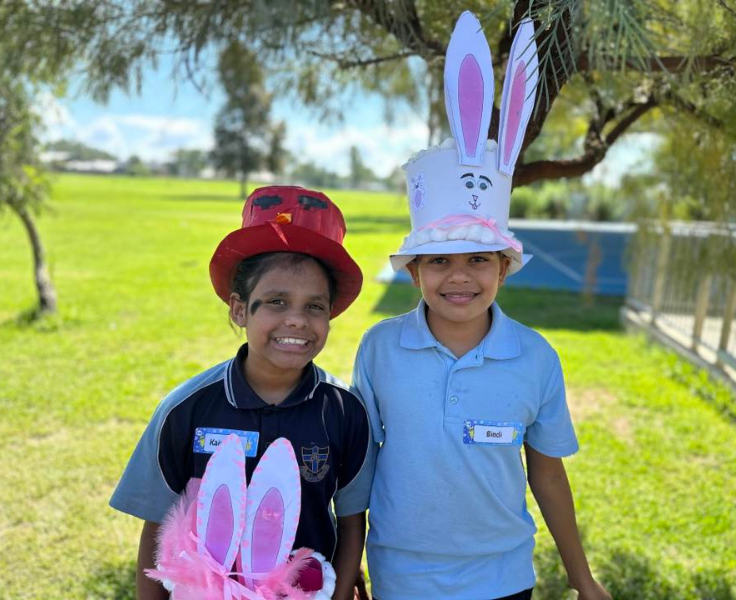 photo of 2 students wearing easter hats