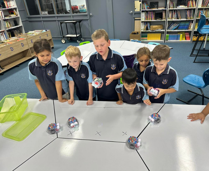 photo of a group of students testing out some of our different robotics equipment